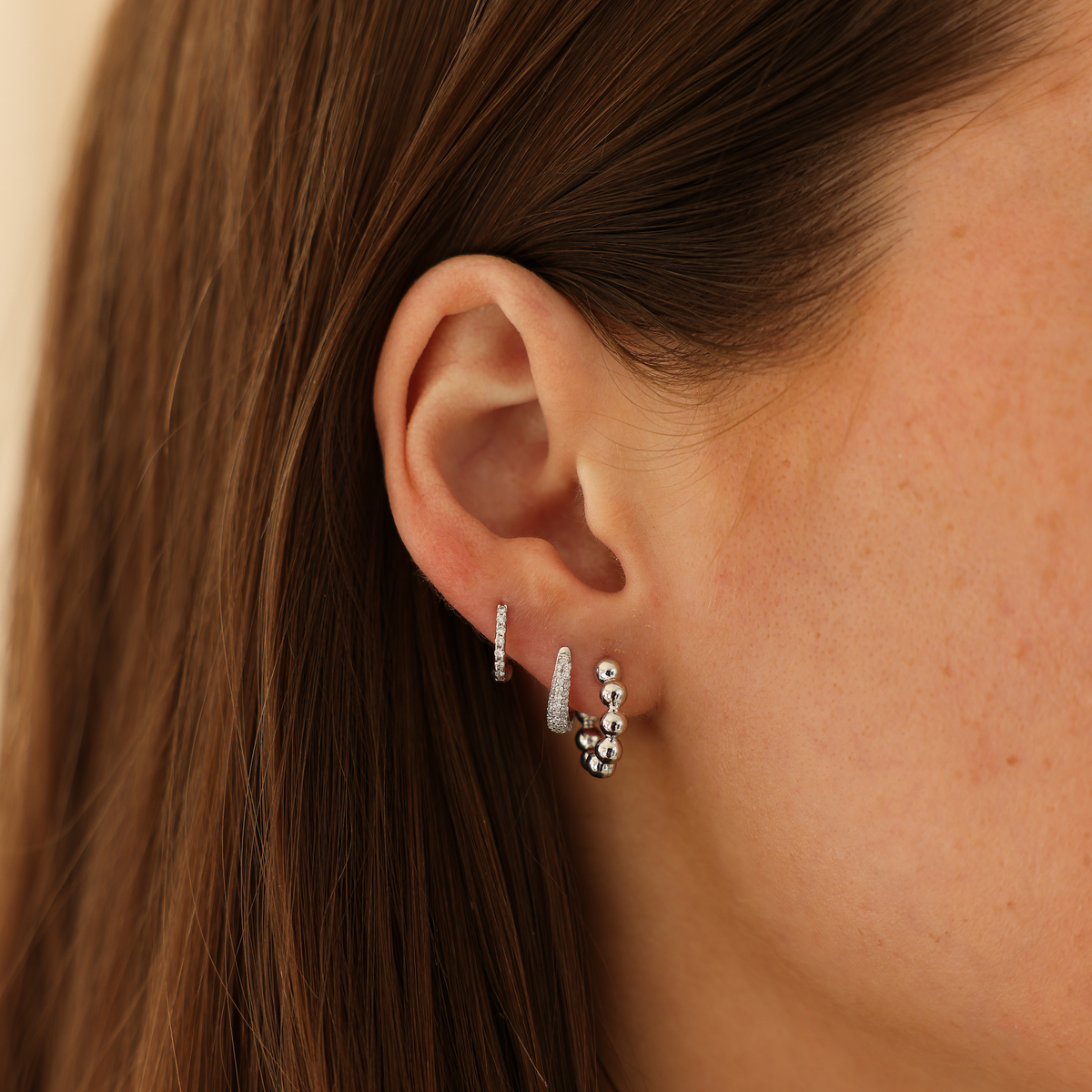 White Gold-2^Diamond Huggie Earrings: Poppy Rae Pebble Hoops in White Gold