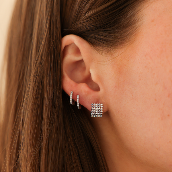 White Gold-2^Diamond Huggie Earrings: Poppy Rae Pebble Row Hoops in White Gold